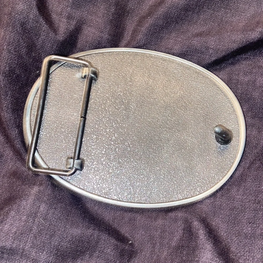 Browning Buck mark silver plated belt buckle with pink rhinestones.